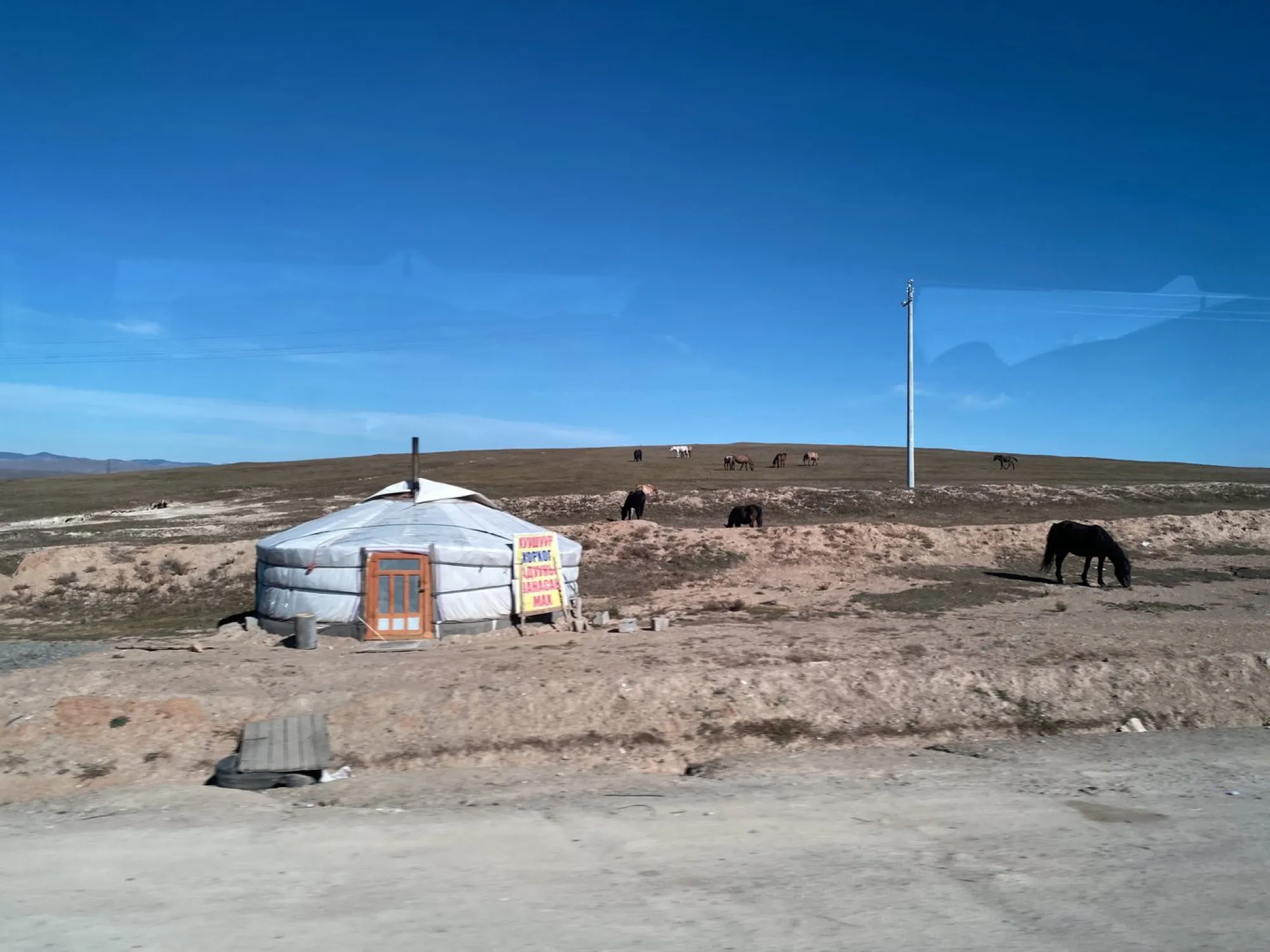 A ger alone on dry grassland in Mongolia, 2024.